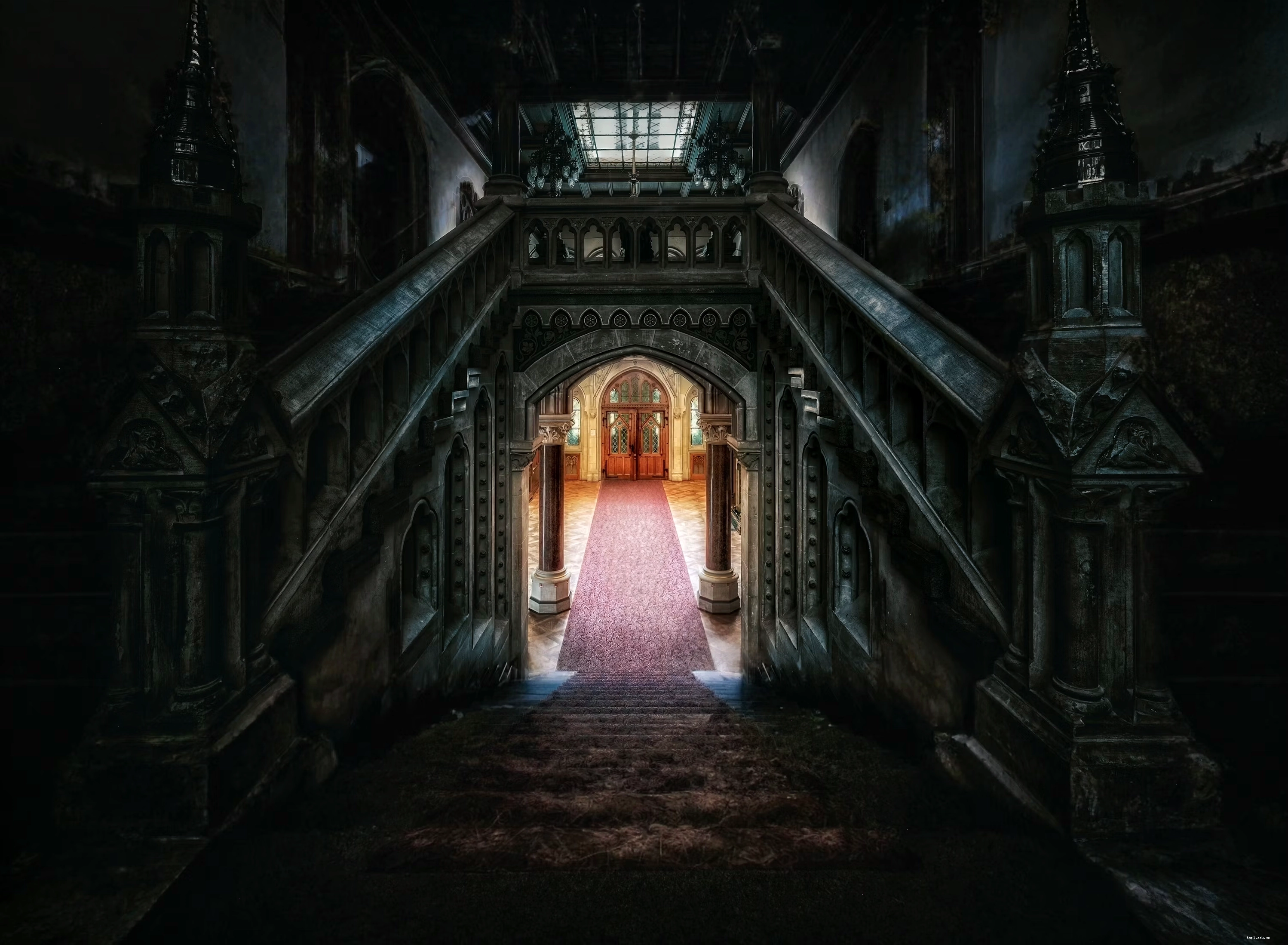 A dark staircase leads to a lighted hallway