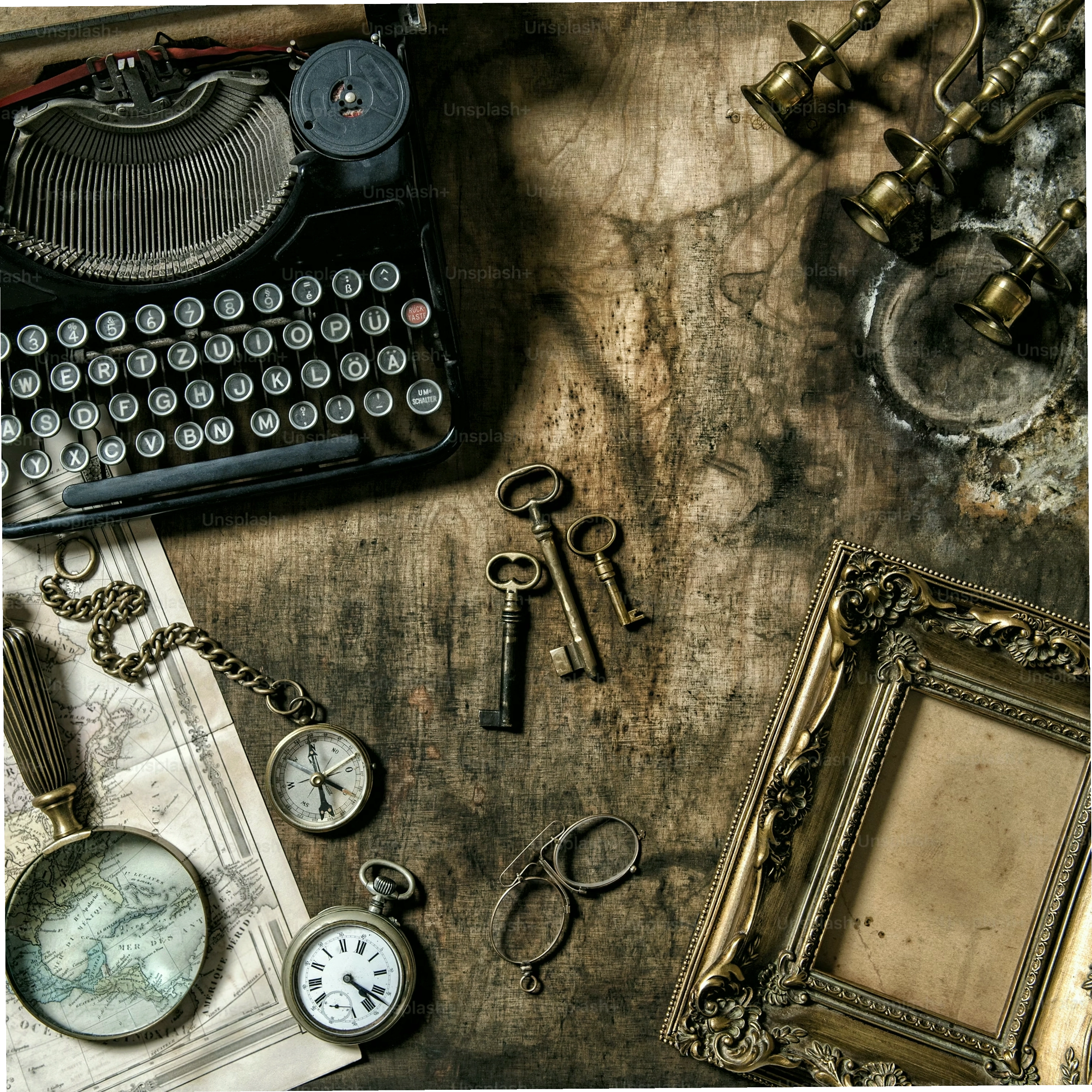 Antique typewriter and vintage office tools on a wooden table